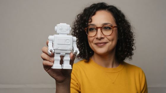 Artifact anchor preset: the robot dominant in the foreground, creator soft behind