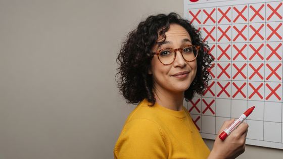 Creator marks a wall calendar covered in red X marks