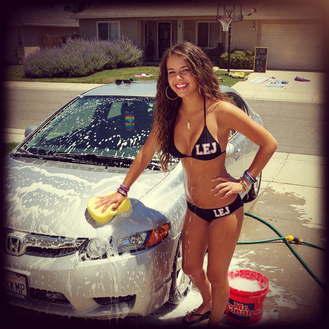 An LEJ girl washing a sedan, Instagram-filtered, 2014.